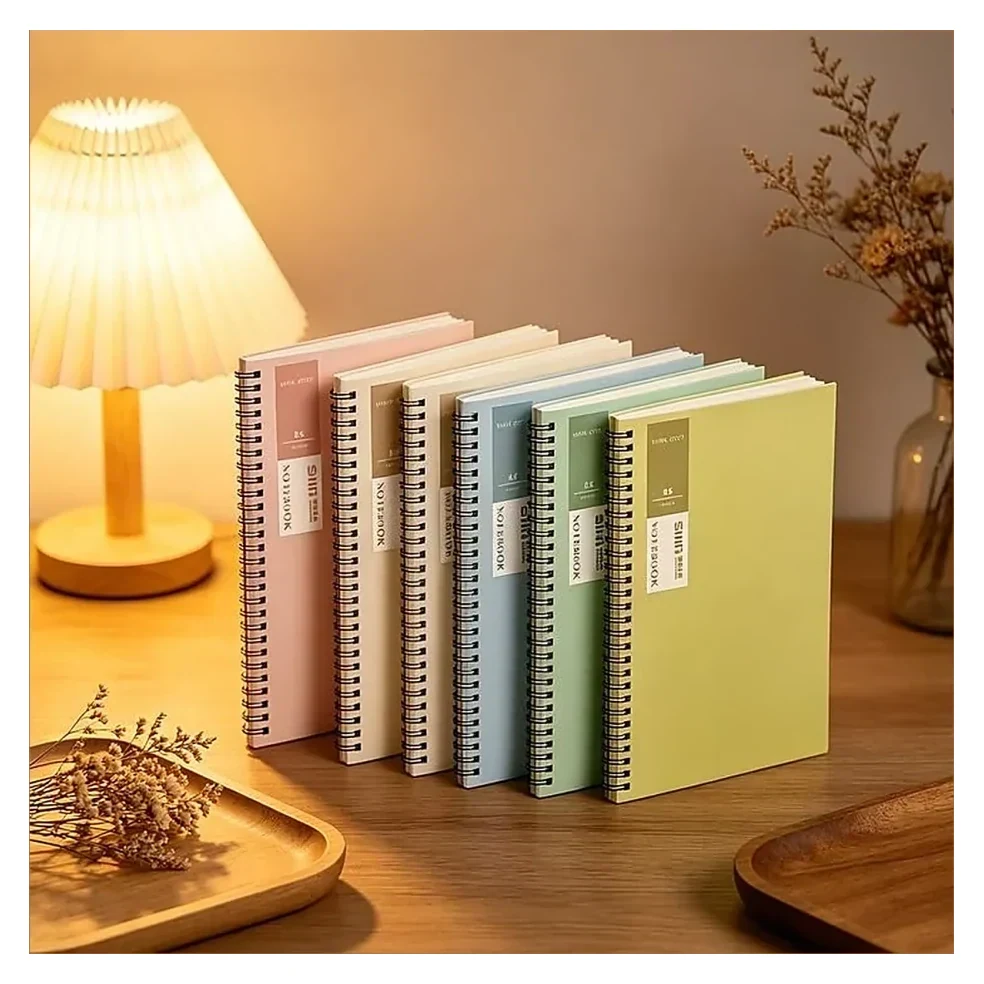 Notebooks on Desk with Lamp